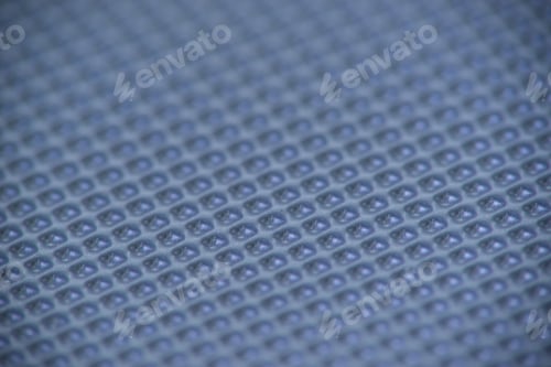 Preview: Perforated Metal Sheet On Dark Blue Background
