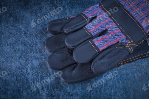 Preview: Horizontal View Of Rubber Construction Gloves On Scratched Metallic Surface Building Concept.