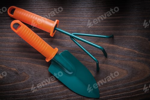 Preview: Hand Gardening Spade With Trowel Fork On Vintage Wood Board Agriculture Concept.