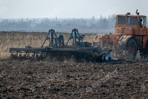 Preview: Tractor Cultivating The Field On The Autumn Day
