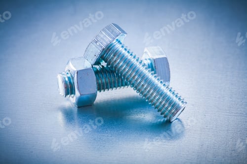 Preview: Metal Bolt Details With Screw Nut On Metallic Background Construction Concept