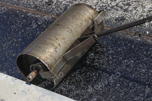 Preview: Hand Roller For Mastic Asphalt Paving. Selective Focus And Shallow Dof, Some Motion Blur Present.