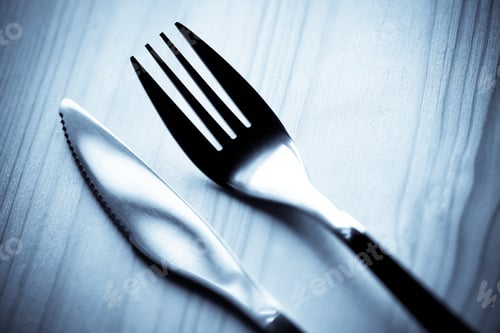 Preview: Fork And Knife On A Wooden Table