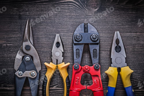 Preview: Sharp Tin Snips Steel Cutter Pliers On Wooden Board.