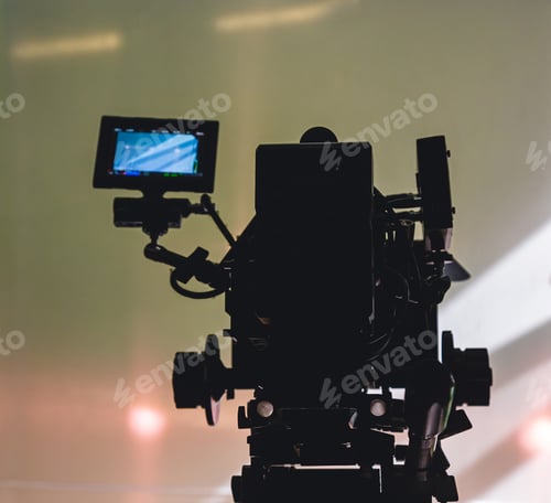 Preview: Dark Silhouetted Professional Video Camera with Monitor