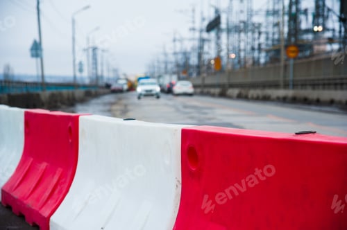 Preview: Repair Of Asphalt Pavement. Orange Construction Light On Barricade And Red Safety Barriers On The