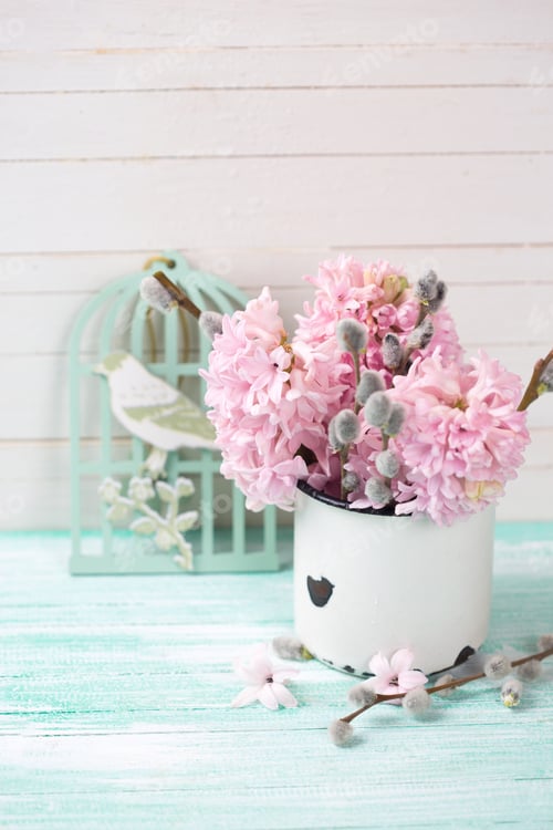 Preview: Background With Hyacinths, Willow Flowers In Aged Mug And Decorative Bird On Turquoise Painted