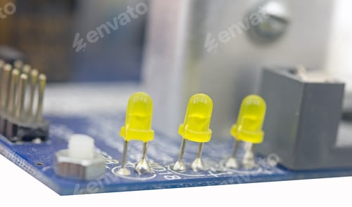 Preview: Three Yellow Leds On Modern Circuit Board On White Background