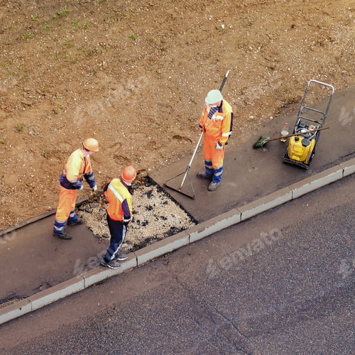 Preview: Workers Plug A Hole In The Sidewalk Removing The Old Asphalt To Install A New One