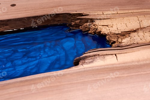 Preview: Process Making Of A Craft Resin And Wood Table. Liquid Epoxy Is Poured Into A Mold With Wooden