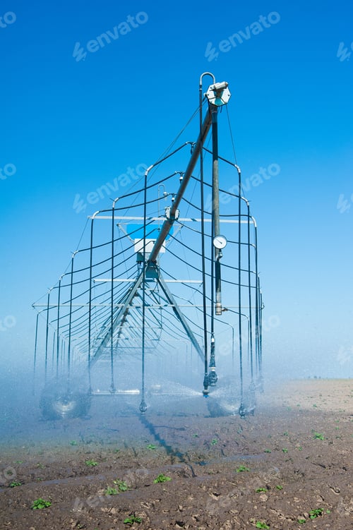 Preview: Automated Farming Irrigation Sprinklers System On Cultivated Agricultural Landscape Field