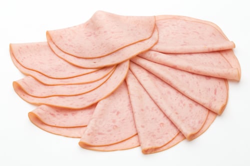 Preview: Sliced Boiled Ham Sausage Isolated On White Background.