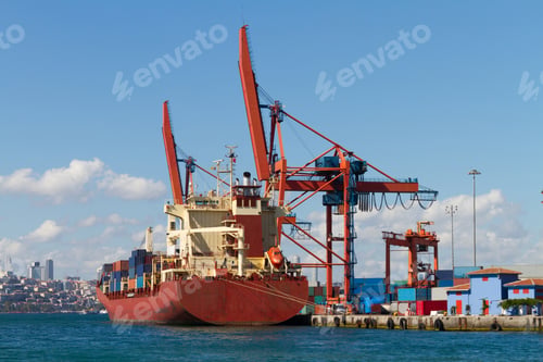 Cargo Ship Docked at Port with Cranes