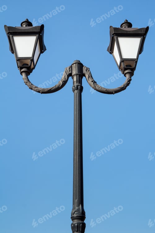 Preview: Vintage Black Street Lamppost With Two Lamps On Blue Sky Background