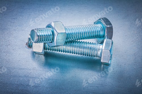 Preview: Pair Of Stainless Nuts And Bolts On Metallic Background Construction Concept