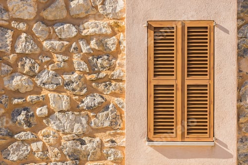 Preview: Brown Window Shutters And Rustic Stone Wall Background Of An Mediterranean House.
