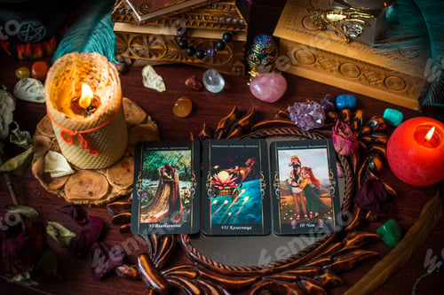 Preview: Cartomancy. A Fortune Teller, Tarot Cards. On The Table Are Candles And Fortune-Telling Objects