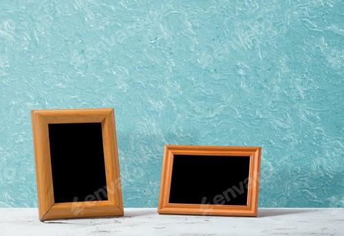Preview: Wooden Photo Frames On Table, Blue Wall