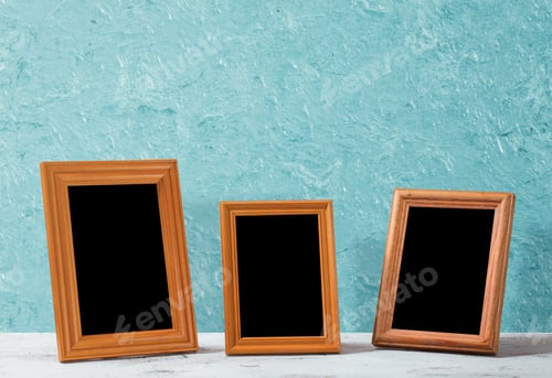 Preview: Wooden Photo Frames On Table, Blue Wall