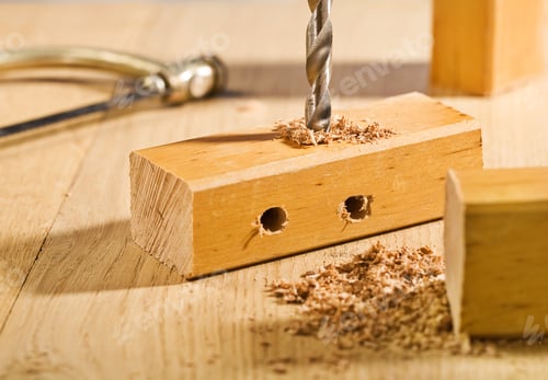 Preview: Drilling Hole In A Wooden Plank On Table