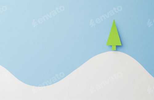 Preview: Small Paper Christmas Tree Cut From Green Paper Over Blue Background