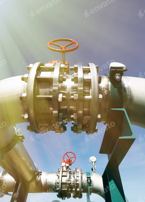 Preview: Industrial Zone, Steel Pipelines And Valves Against Blue Sky
