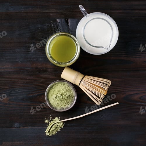 Preview: Green Matcha Tea Served With Cream And Green Matcha Powder With Various Bamboo Accessories For Tea