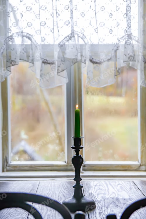 Preview: Green Candle In Vintage Copper Candle Holder On Wooden Table Near The Window In Country House