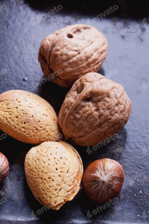 Preview: Selection Of Various Nuts: Almonds, Brazilian, Walnuts On A Vintage Black Metal Tray