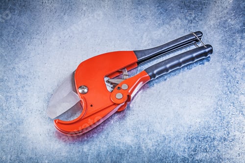 Preview: Sharp Pipe Cutter On Metallic Background Construction Concept.