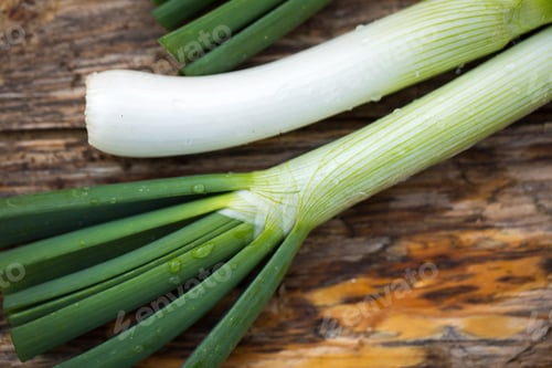 Preview: Fresh Raw Spring Onions On A Wooden Board