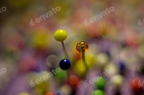 Preview: Color Sewing Pins And Detail Of Reflection For Colored Abstract Background.