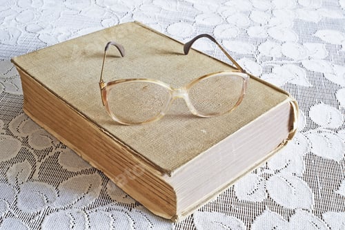 Preview: View Of Old Books And Glasses On The Table