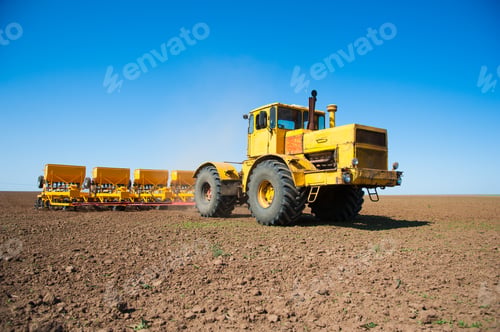 Preview: Farmer In Tractor Preparing Farmland With Seedbed For The Next Year