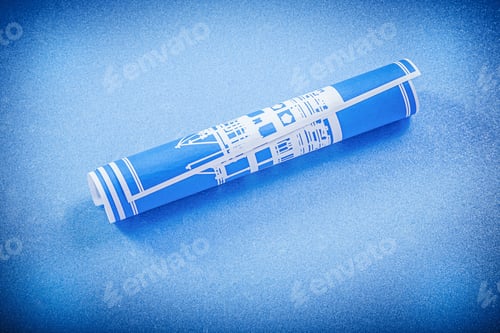 Preview: Blueprint Roll On Blue Background Construction Concept.