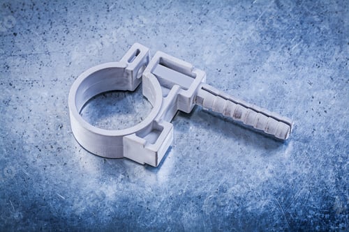 Preview: Plastic Pipe Clamp On Metallic Background Construction Concept.