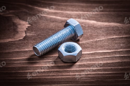Preview: Vintage Wooden Board With Metal Bolt And Screw Nut Repairing Concept