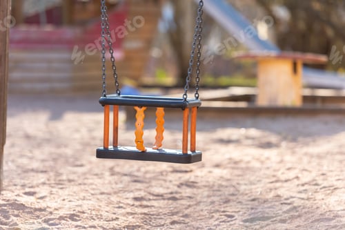 Preview: An Empty Baby Swing In A Playground