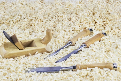 Preview: Three Chisels And One Spokeshave Lying In Wooden Shavings