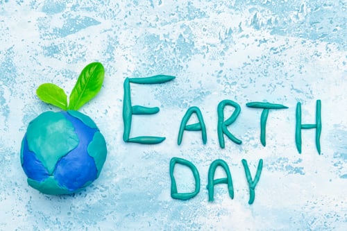 Preview: Planet And Text Earth Day On Color Background