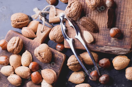 Preview: Selection Of Various Nuts: Almonds, Brazilian, Walnuts On Tiny Vintage Wooden Boards, Black