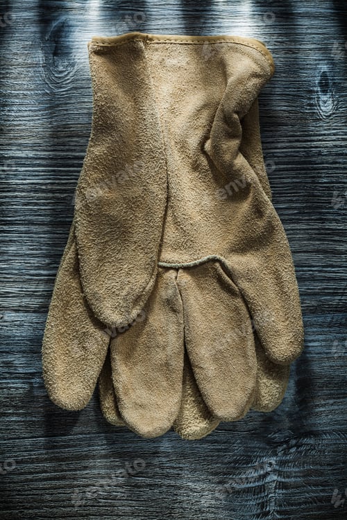 Preview: Safety Gloves On Wooden Board.
