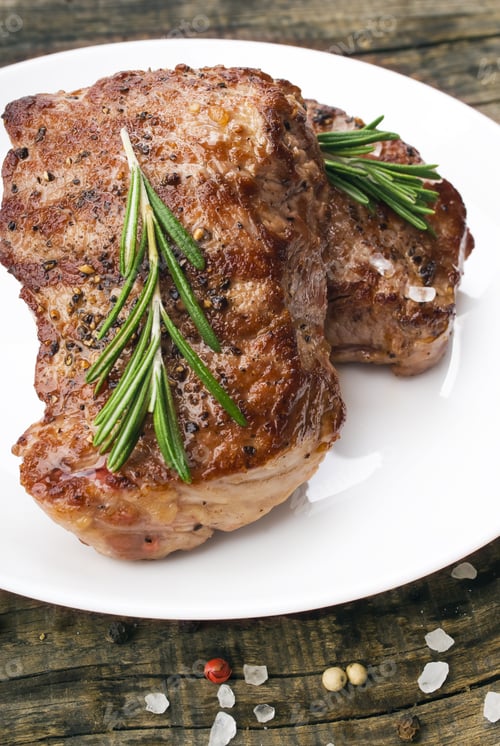 Preview: Beef Steak On A Wooden Table.