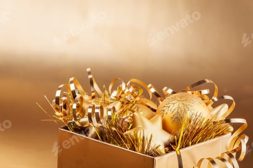 Preview: Christmas Composition Of Christmas Tree Toys On A Blurred Gold Background