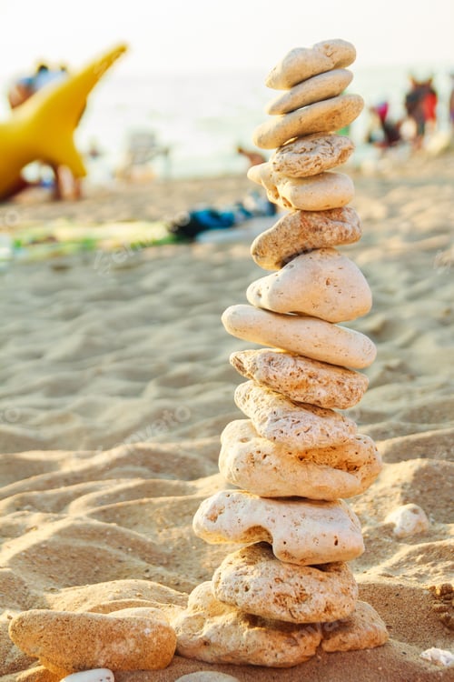 Preview: Pyramid Of Stones On The Beach