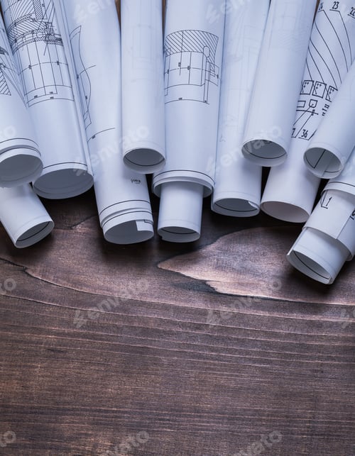 Preview: Set Of Blueprint Rolls On Pine Wooden Vintage Board Construction Concept