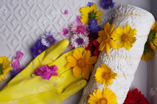Preview: Different Flowers In The Capacity With The Paint Roller And Yellow Rubber Gloves. The White
