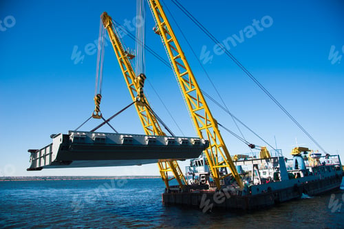 Preview: Loading In Port. Floating Port Crane On Blue Sky Background. Chains And Hooks Hoist With Slings For