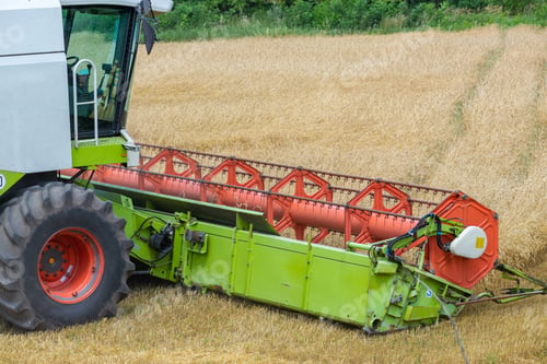 Preview: Harvester At Work On The Field Harvesting Ripe Wheat