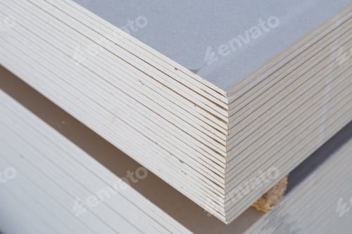 Preview: A Stack Of Drywall Sheets Is Stored In A Wholesale Warehouse. Selective Focus With Blurred